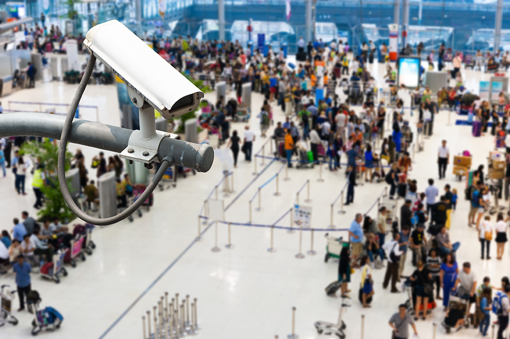 CCTV camera or surveillance operating with crowded people in bac